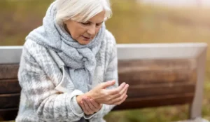 older lady holding her wrist in pain
