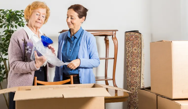 mom and daughter packing items