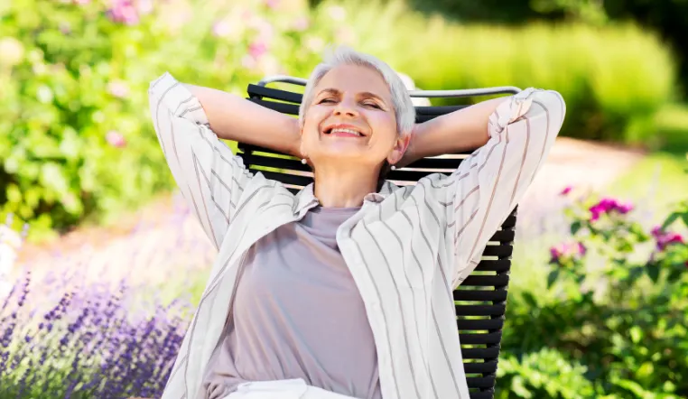 senior relaxed in a chair outside