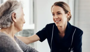 nurse smiling looking at resident
