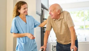nurse and resident smiling at each other