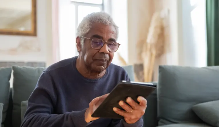 senior man using a tablet