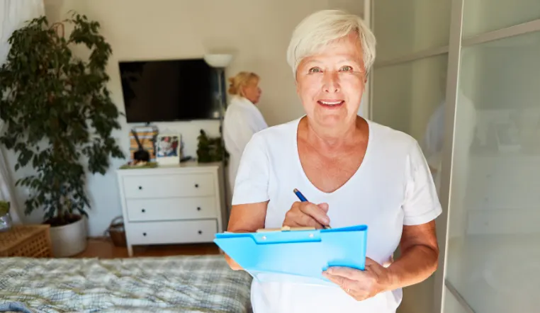 senior woman holding a clipboard