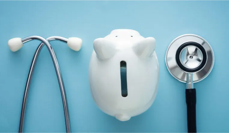 piggy bank and a stethoscope