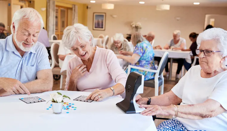 seniors playing bingo at a table