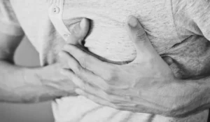 man holding his chest