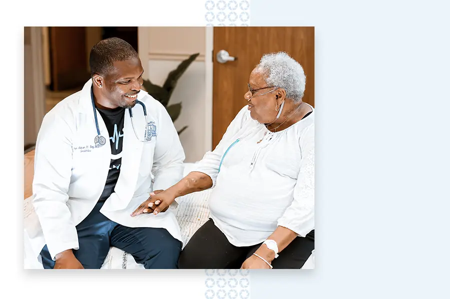 Doctor holds a woman's hand for her therapy program