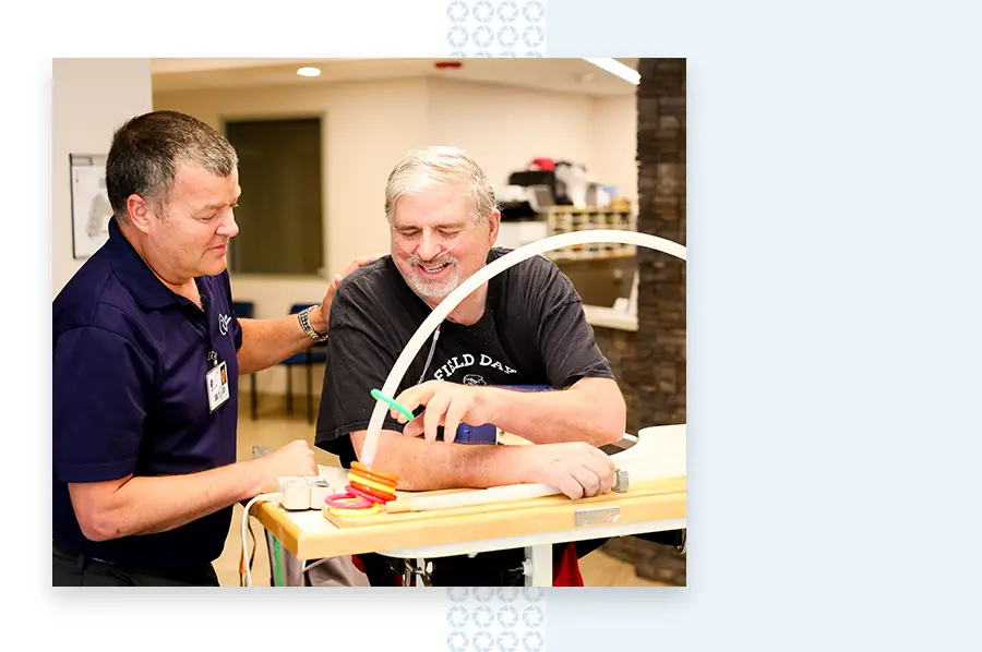 Physical Therapist working with resident