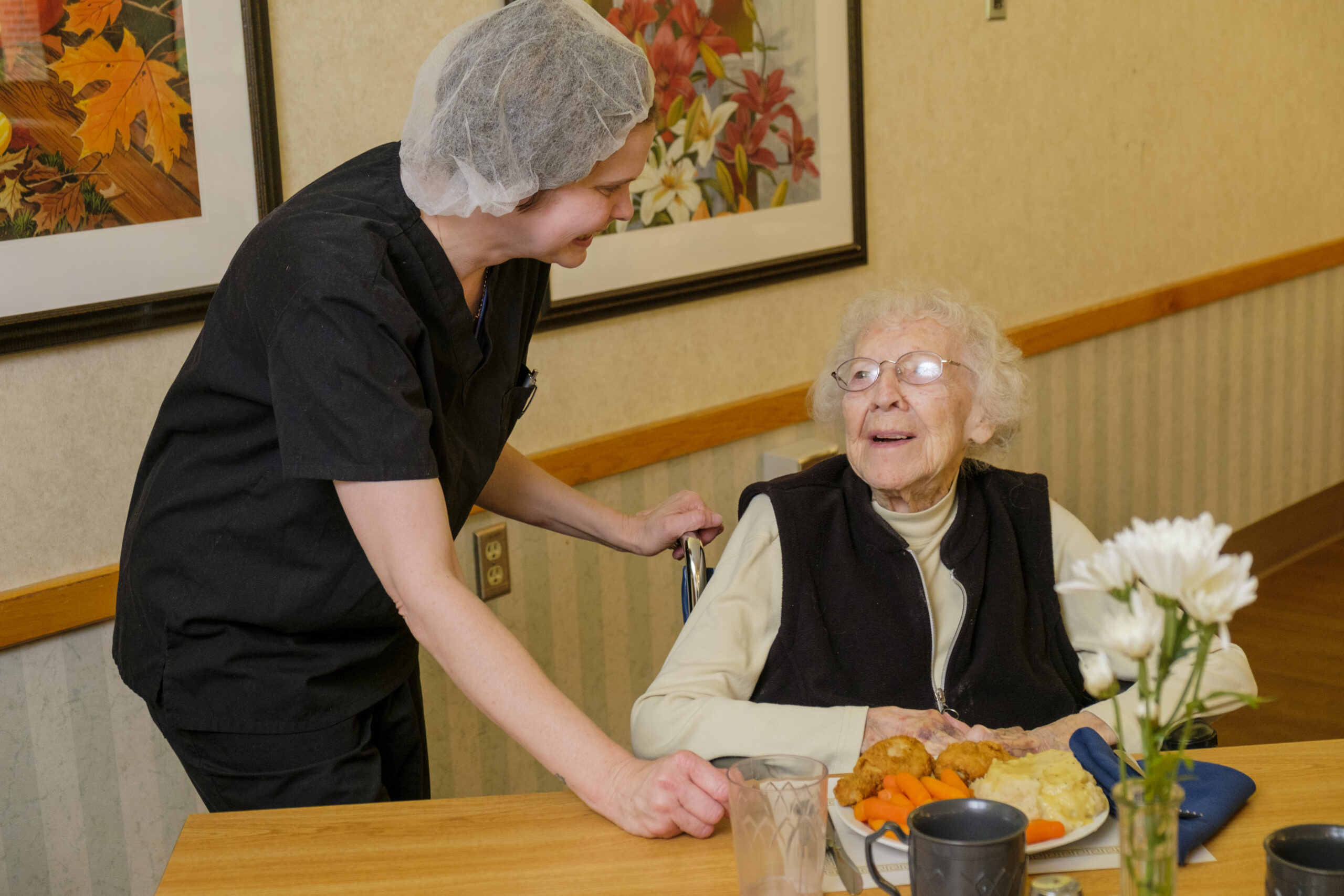 Senior being served meal