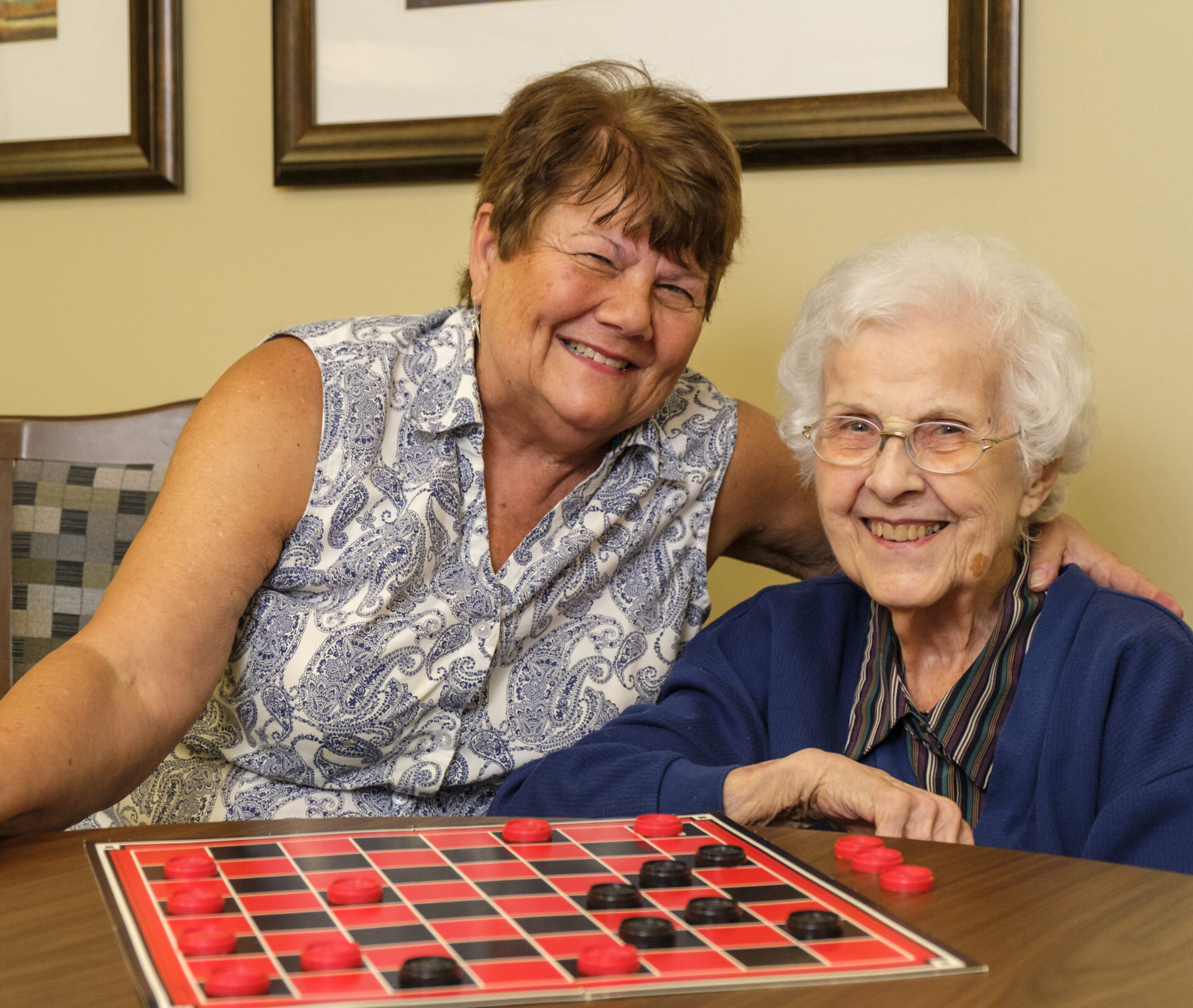 West Park resident and family play checkers