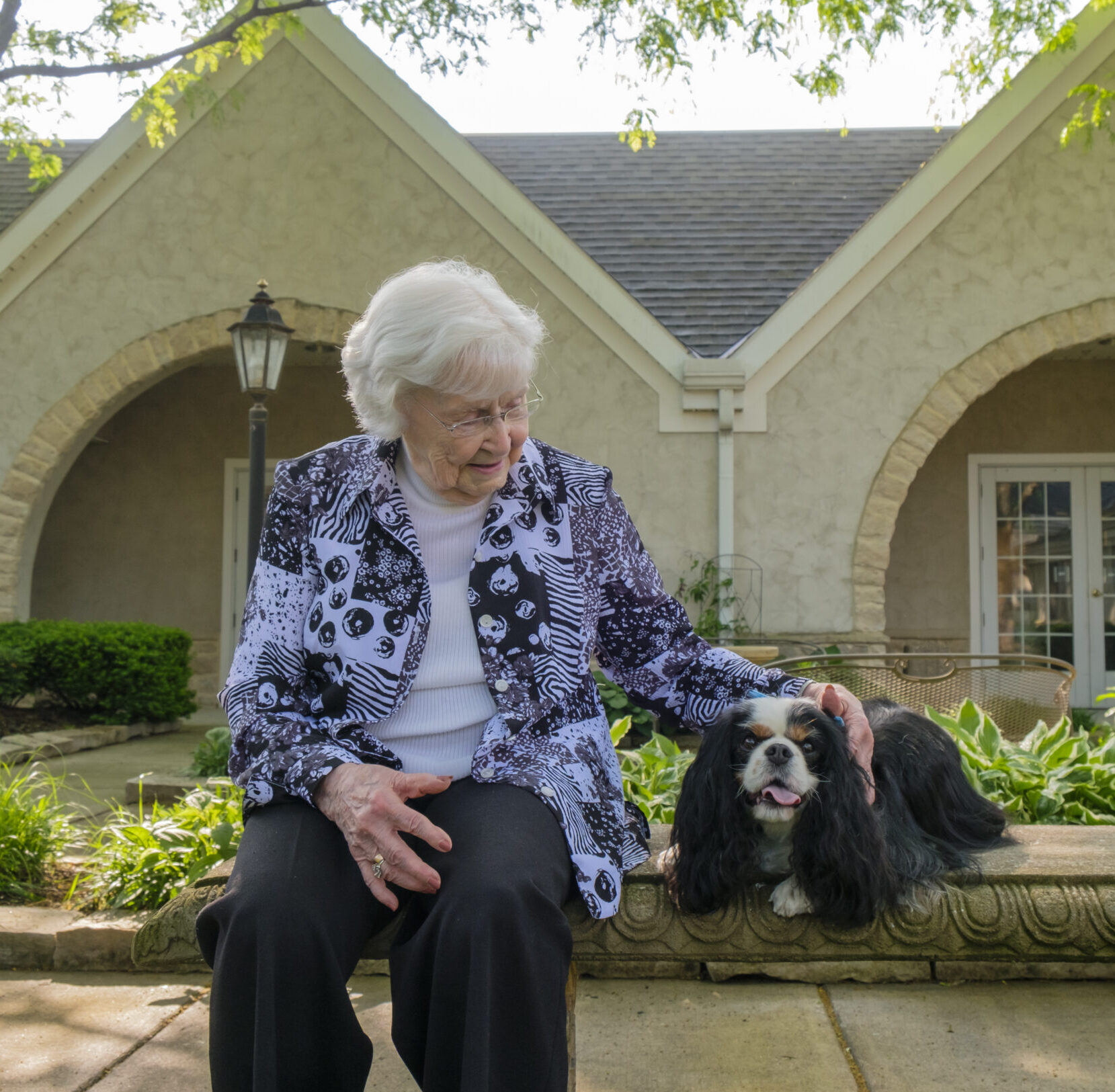 Senior woman with King Charles Spaniel